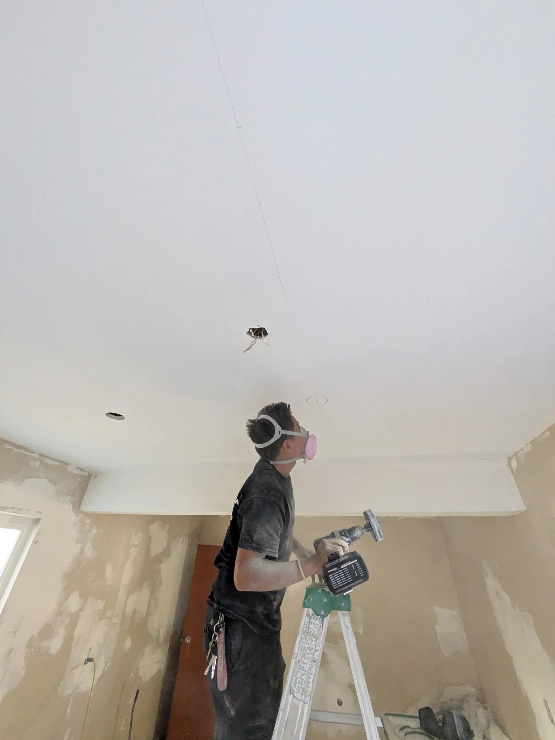 LED strip light installation in progress — wiring and channel mounting