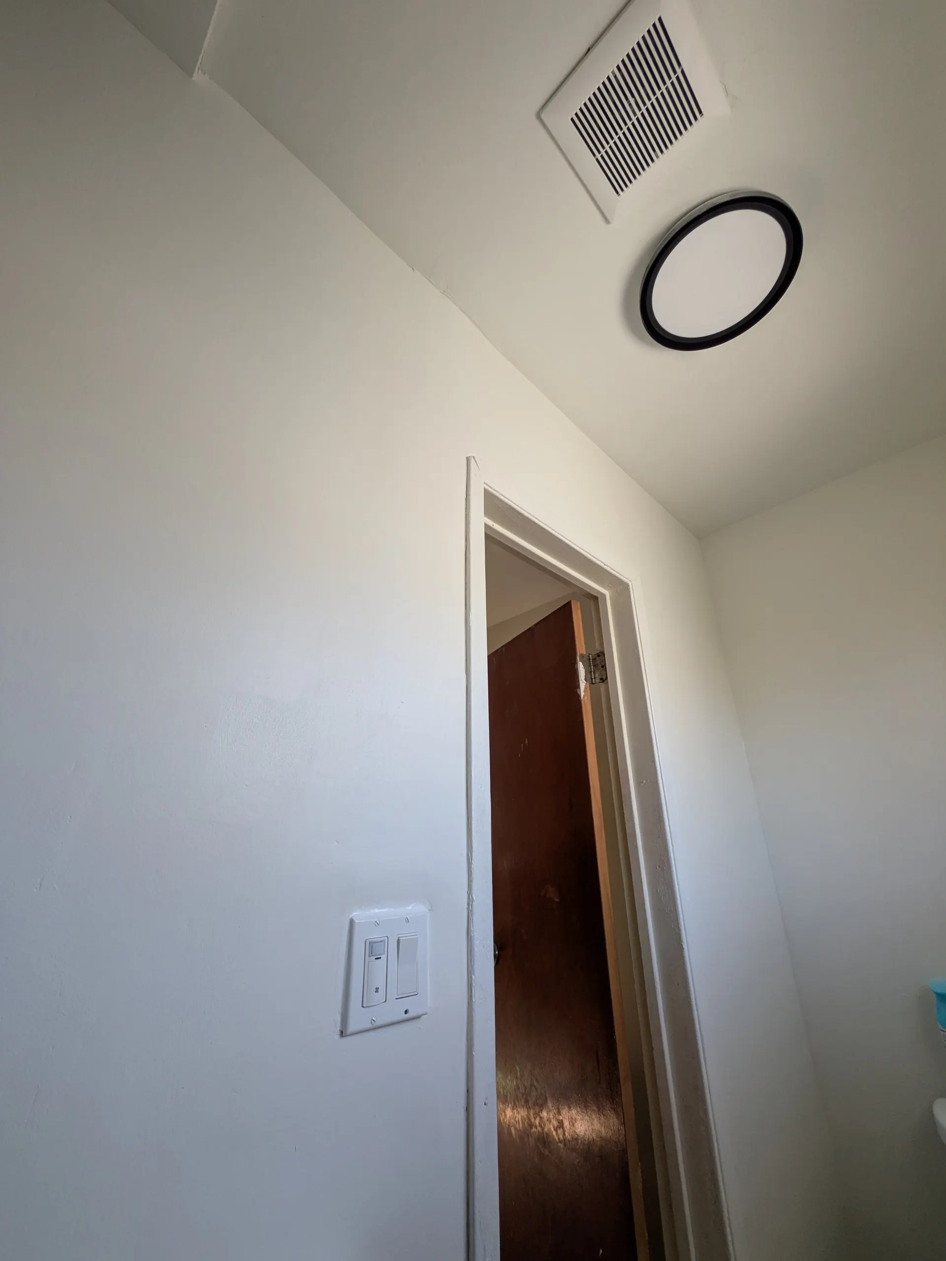 Leviton humidity sensor switch installed for automatic bathroom exhaust fan in Los Angeles