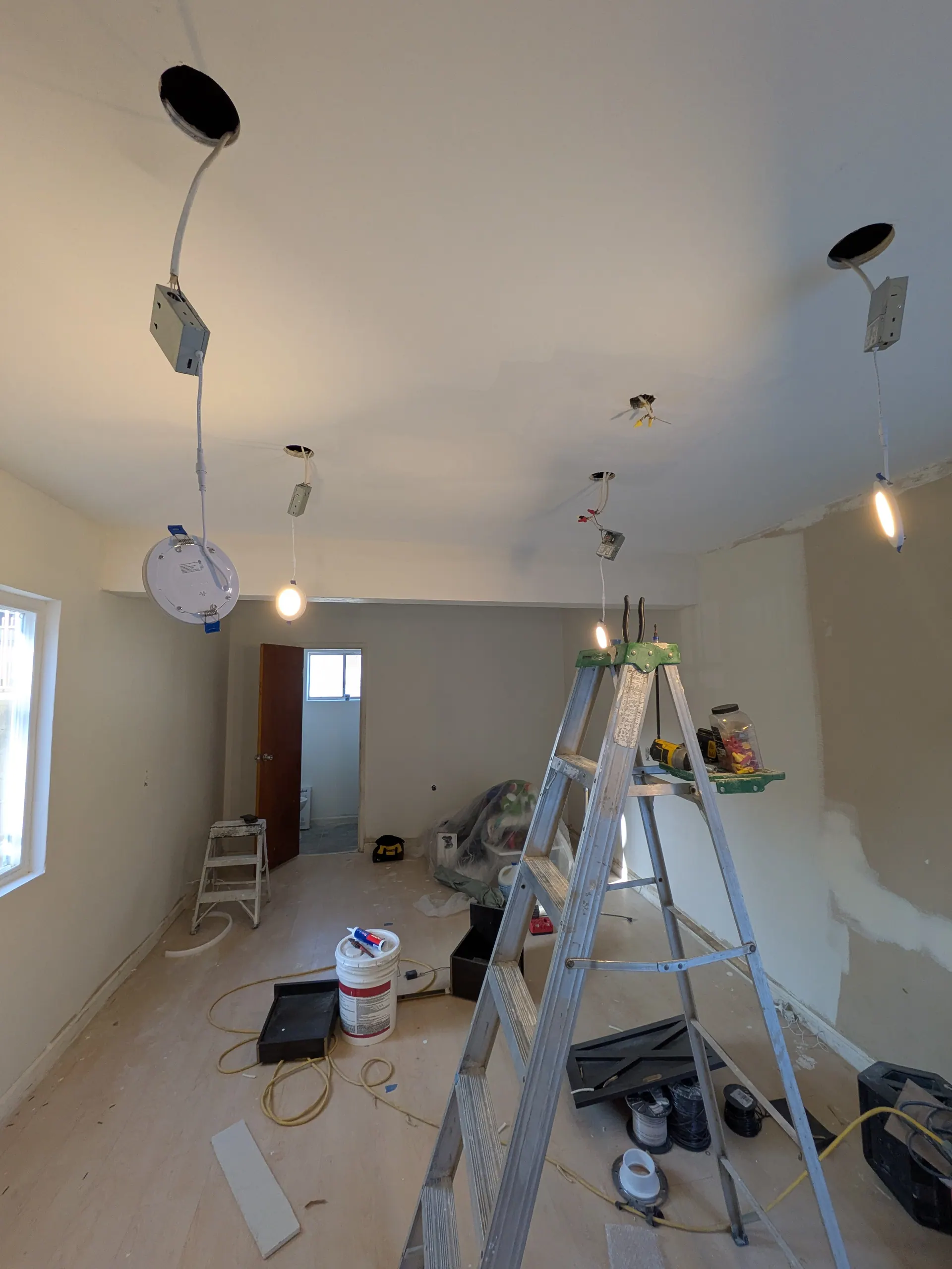 Rough-in wiring for LED strip light installation in progress